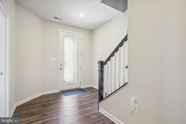 entryway with dark hardwood / wood-style floors