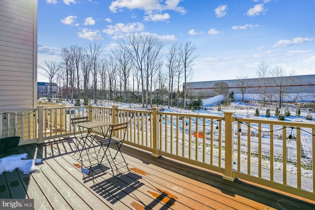 view of snow covered deck