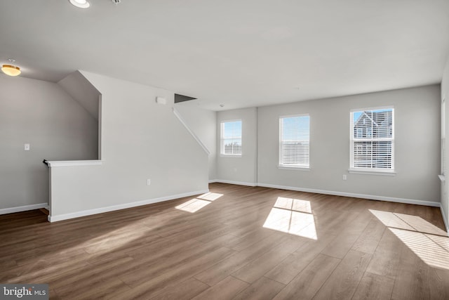 unfurnished living room featuring wood-type flooring