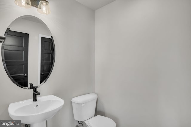 bathroom with sink and toilet