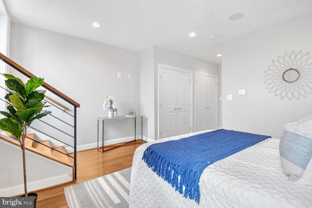 bedroom with wood-type flooring and a closet