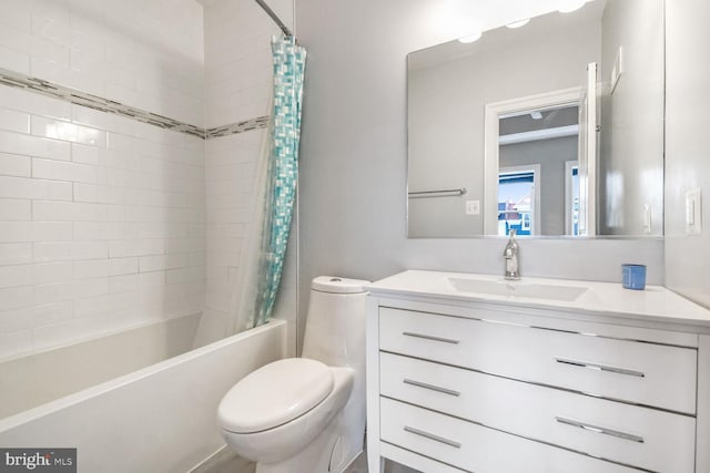 full bathroom featuring shower / bath combo, toilet, and vanity