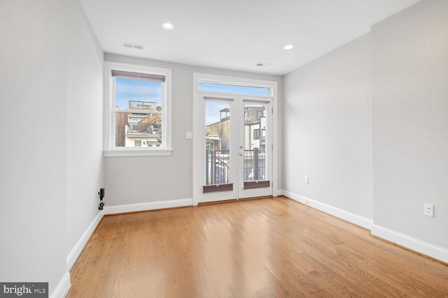 spare room featuring light hardwood / wood-style floors