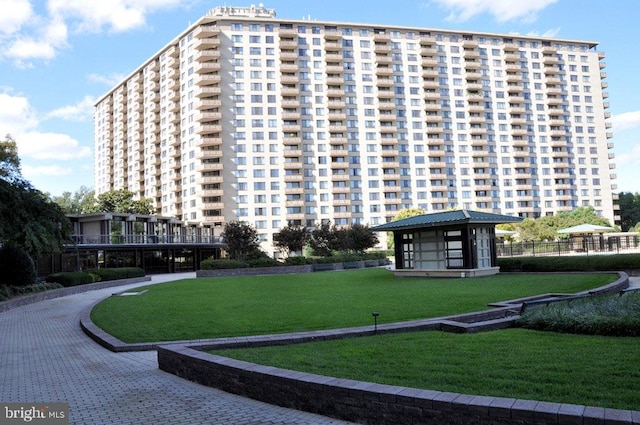 view of home's community with a lawn