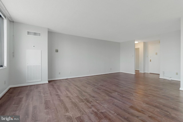 empty room featuring wood-type flooring