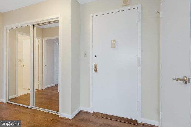 foyer entrance with hardwood / wood-style floors