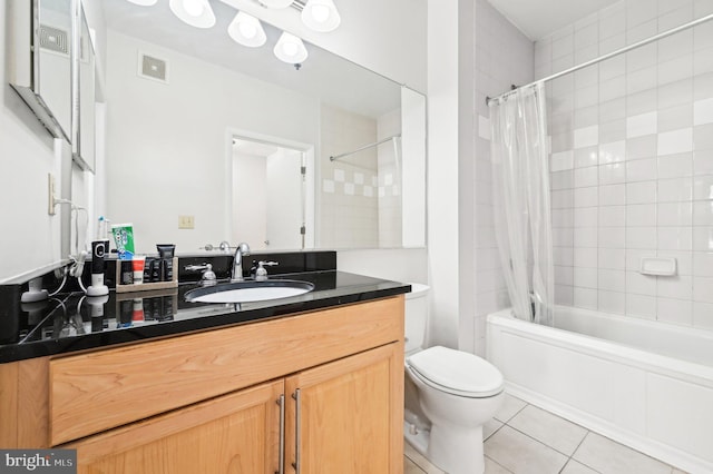 full bathroom featuring vanity, toilet, tile patterned flooring, and shower / bath combo