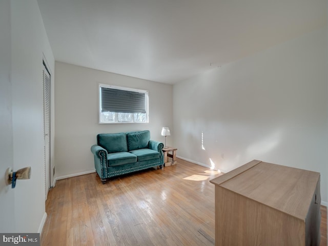 sitting room featuring light hardwood / wood-style floors