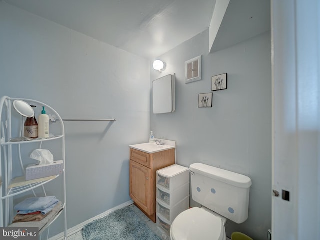 bathroom with toilet and vanity