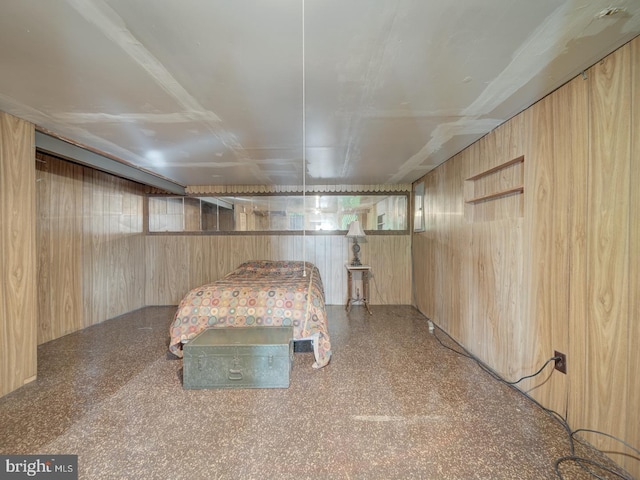 unfurnished bedroom featuring wooden walls