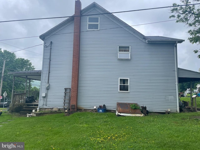 view of home's exterior with a lawn