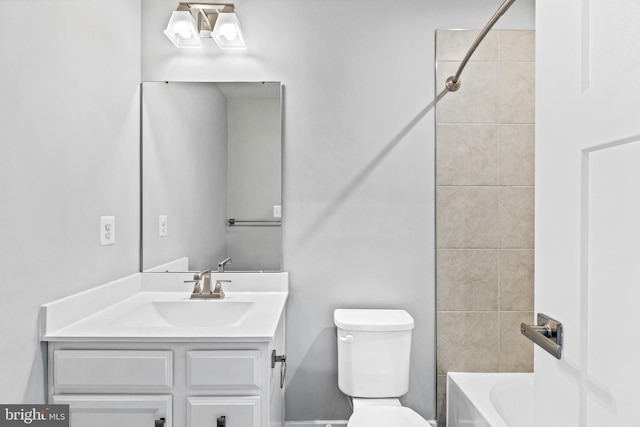 full bathroom with vanity, toilet, and tiled shower / bath combo