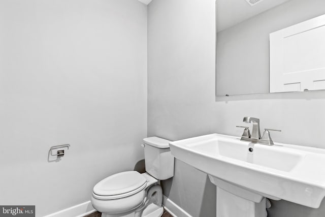 bathroom with toilet and sink