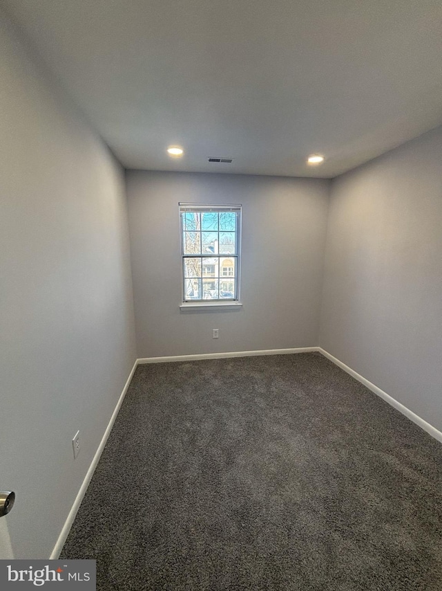 unfurnished room with carpet floors