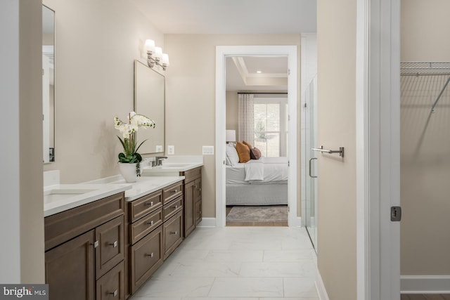 bathroom featuring vanity, a raised ceiling, and crown molding