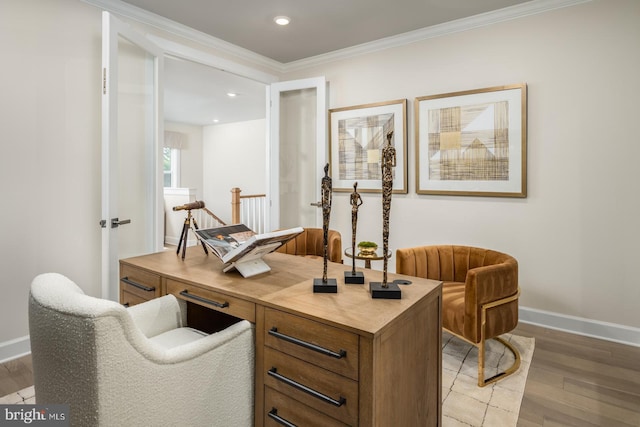 office with ornamental molding and hardwood / wood-style floors