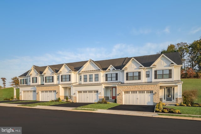 multi unit property featuring a garage