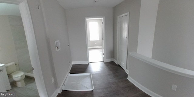 hall with dark hardwood / wood-style flooring