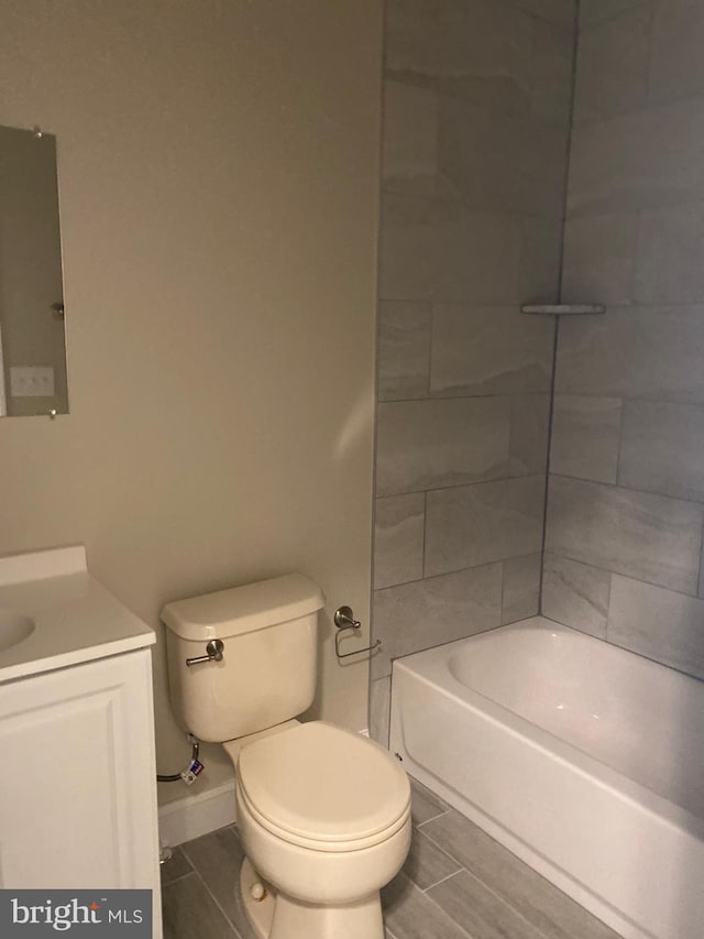 full bathroom with  shower combination, toilet, and vanity