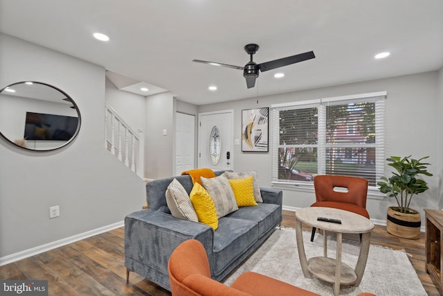 living room with hardwood / wood-style floors and ceiling fan