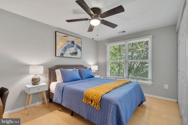 bedroom featuring ceiling fan and light wood-type flooring