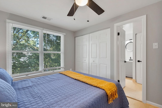 bedroom featuring a closet and ceiling fan