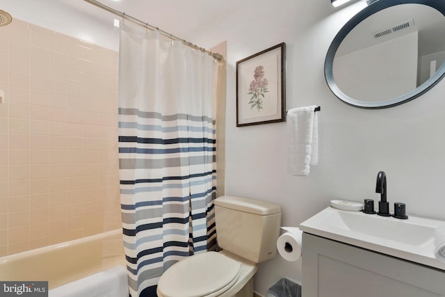 full bathroom featuring shower / bath combination with curtain, vanity, and toilet