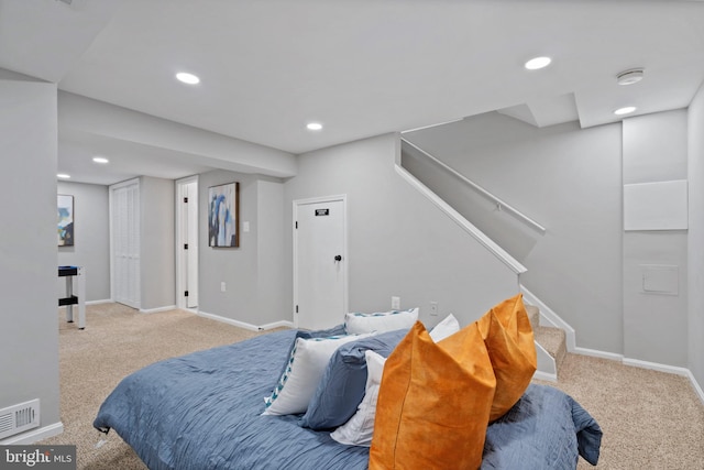 bedroom featuring light colored carpet