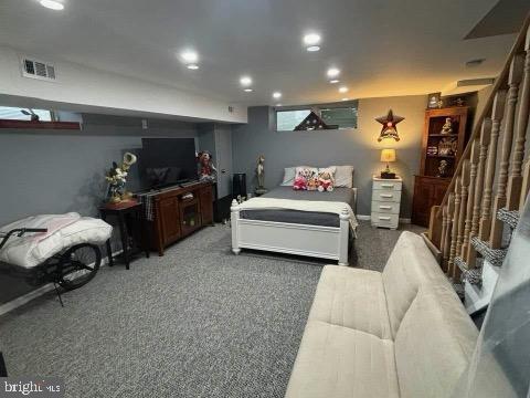 bedroom featuring dark colored carpet