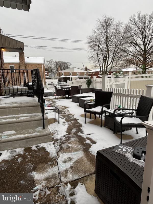 view of snow covered patio