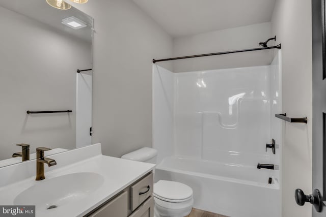 full bathroom featuring vanity, shower / washtub combination, and toilet