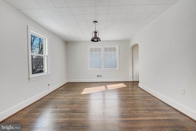 unfurnished dining area featuring dark hardwood / wood-style flooring