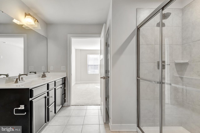 bathroom featuring vanity, tile patterned floors, and walk in shower