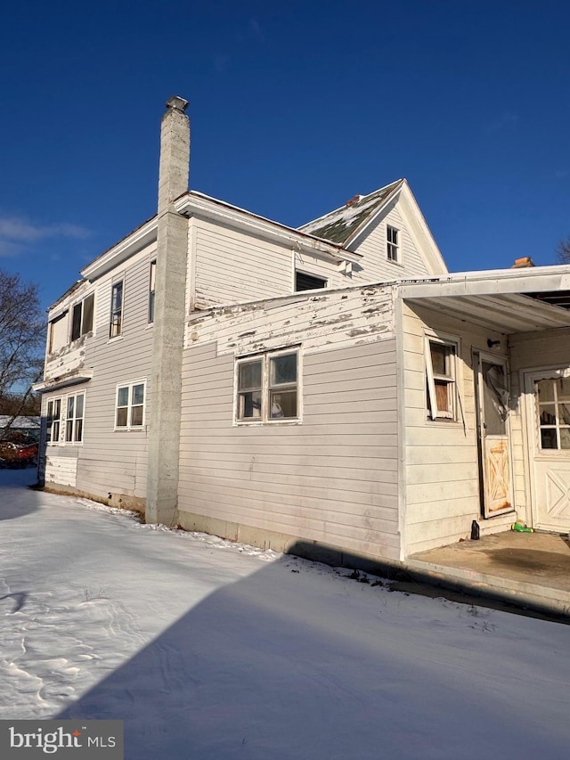 view of side of home with a patio area