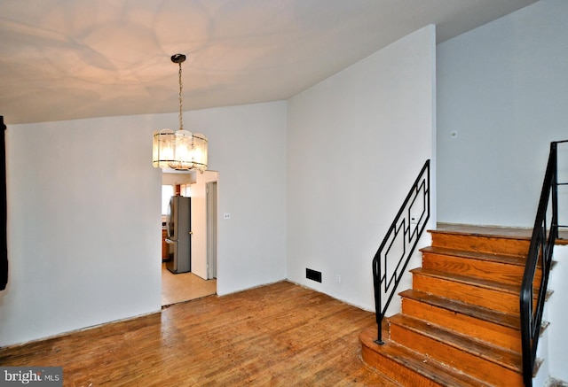 stairway with wood-type flooring