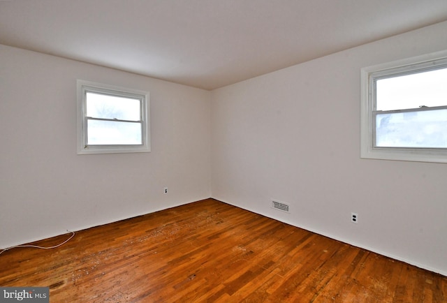 unfurnished room featuring hardwood / wood-style floors