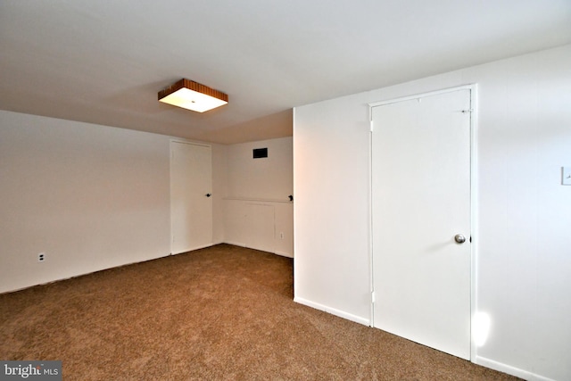 empty room featuring carpet floors