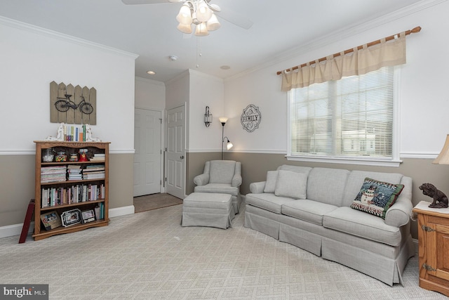 living room featuring ceiling fan, ornamental molding, and light carpet