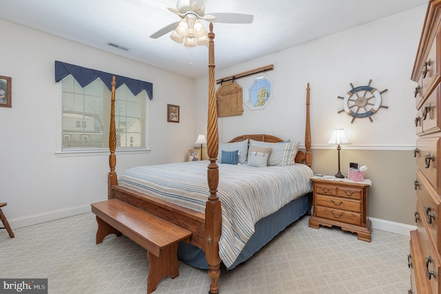 bedroom featuring light colored carpet and ceiling fan