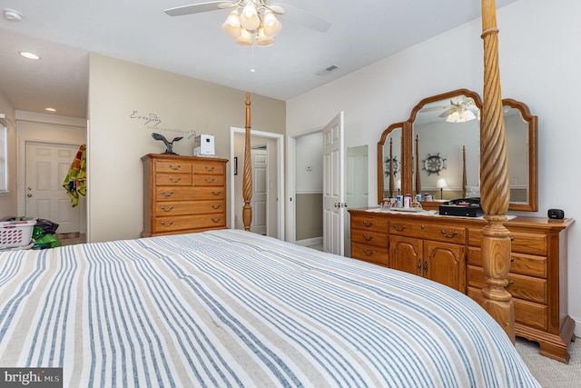 bedroom with ceiling fan and light carpet