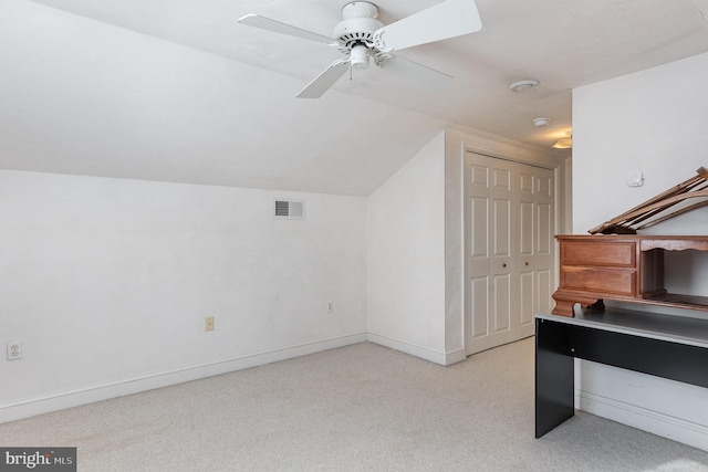 bonus room with light carpet, vaulted ceiling, and ceiling fan