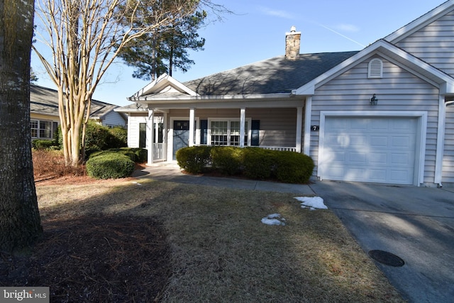 view of front of property with a garage and covered porch