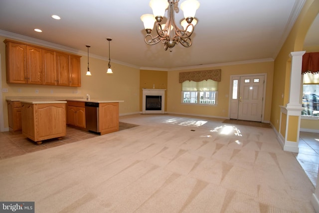 kitchen featuring crown molding, dishwasher, hanging light fixtures, decorative columns, and light carpet