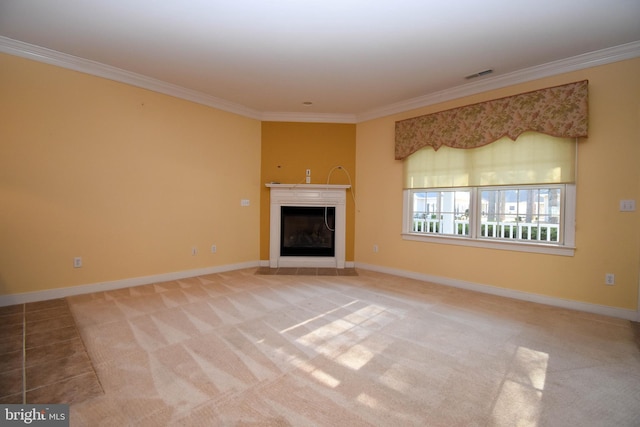 unfurnished living room with crown molding and carpet floors