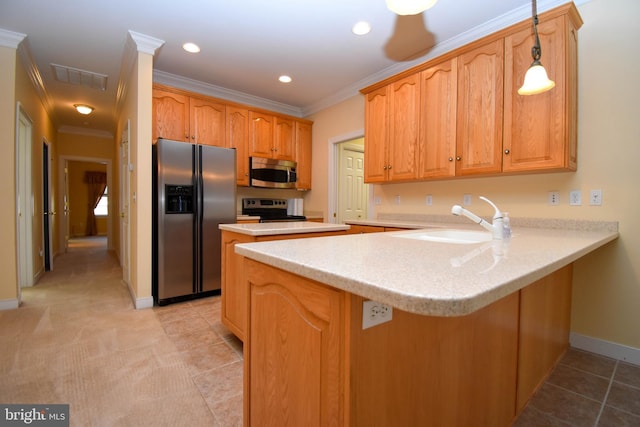 kitchen featuring sink, decorative light fixtures, ornamental molding, kitchen peninsula, and stainless steel appliances