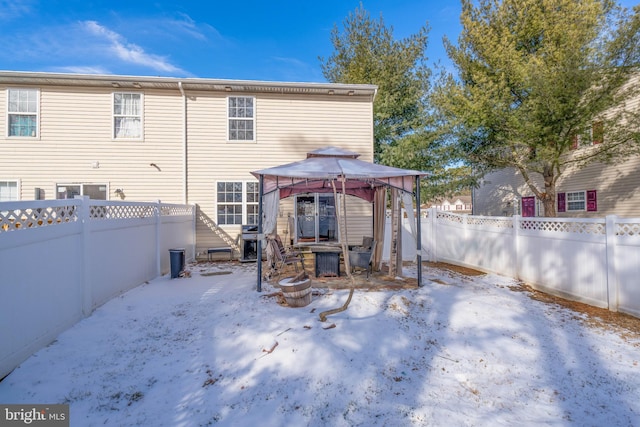 snow covered property featuring a gazebo