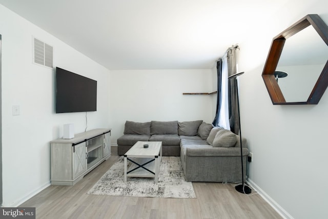 living room with light hardwood / wood-style floors