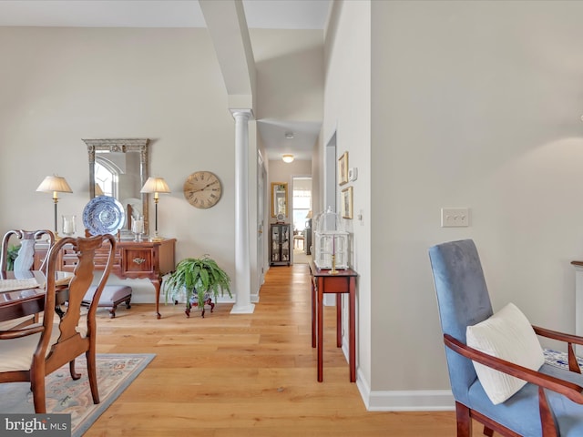 interior space with wood-type flooring and ornate columns