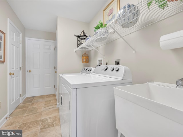 laundry room featuring separate washer and dryer and sink