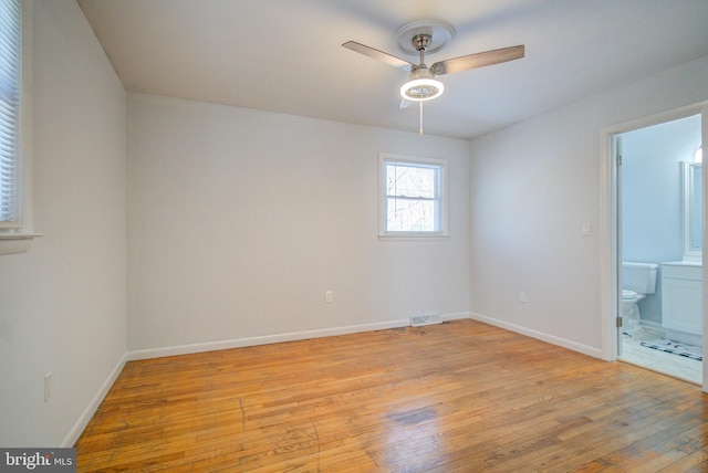 unfurnished room featuring ceiling fan and light hardwood / wood-style floors